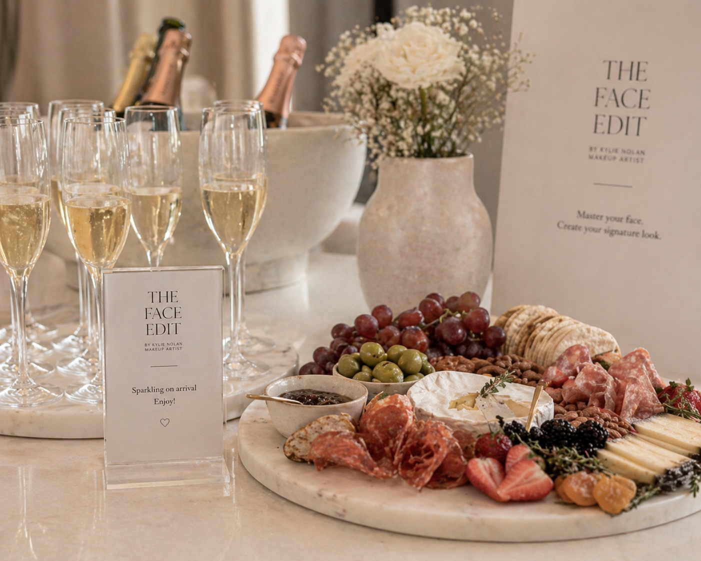 Arrival setup at a Face Edit workshop, sparkling on tray, charcuterie board and signage